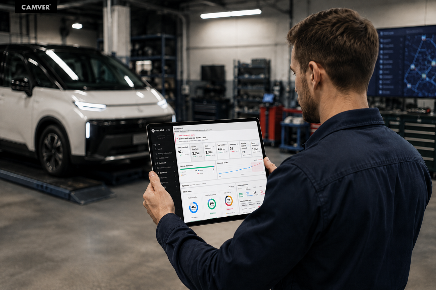 Operator reviewing a Fleet AI OS dashboard on a tablet in a vehicle maintenance facility
